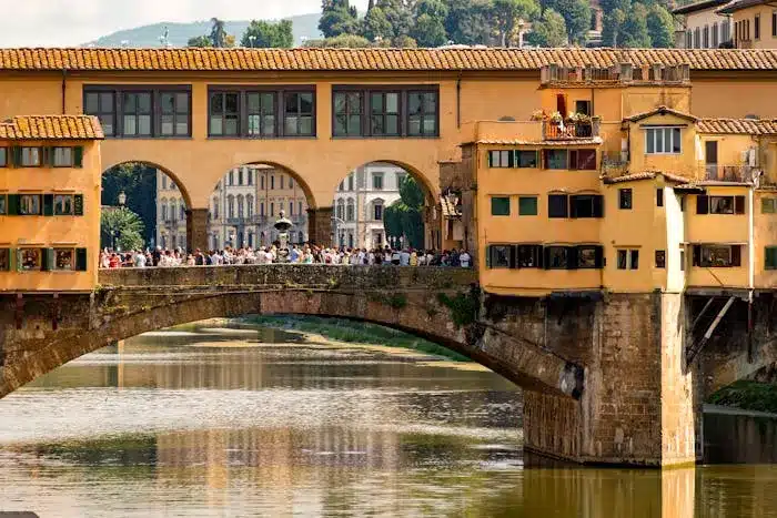 Tourist Standing in the Ponte Vecchio Bridge is a Must Do Experience in florence