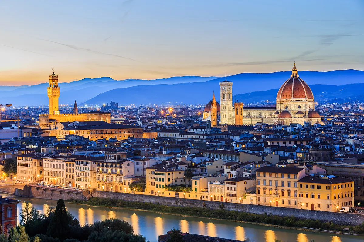 A picturesque view of Florence at dusk, showcasing the city's iconic skyline illuminated by the fading light in our Italy itnerary 10 Days